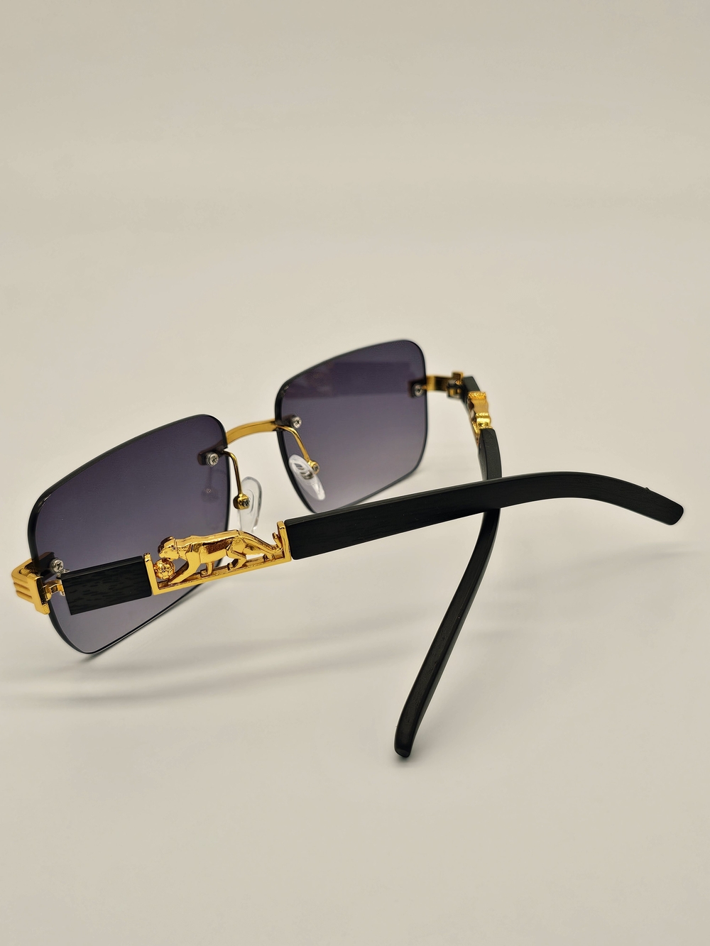 Gold-Accent Black Rimless Sunglasses with Gradient Smoke Lenses